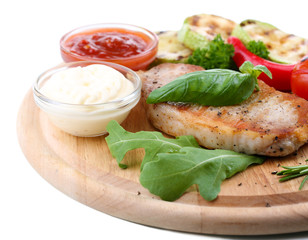 Grilled steak with spices, herbs and vegetables