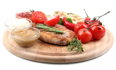 Grilled steak with spices, herbs and vegetables