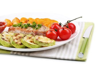 Grilled steak and grilled vegetables on plate, isolated on