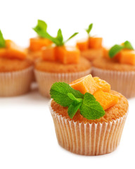 Tasty pumpkin muffins, isolated on white