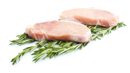 Raw meat steak with herbs isolated on white