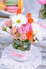 Beautiful bouquet of bright flowers in jar