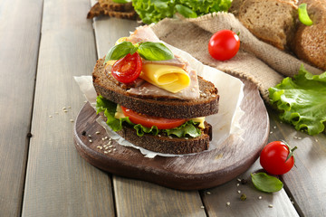 Delicious sandwiches with meet on table close-up