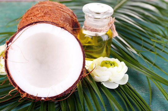 Coconuts and coconut oil on wooden table