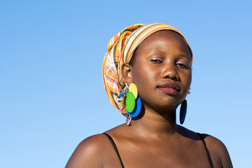 Portrait of young confident african woman with scarf