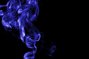 Blue smoke on black background