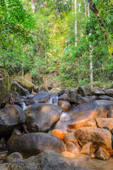 Naklejka na ściany i meble Evergreen forest waterfall in Chanthaburi, Thailand