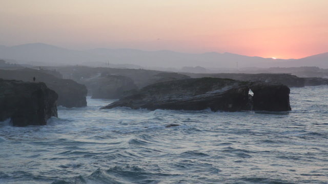 Storming waves during inflow at sunset on Playa de las Catedrale