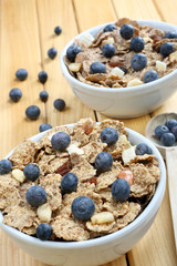 Healthy whole grain muesli and bran breakfast with fruits