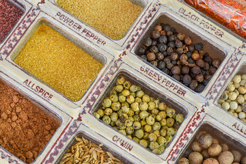 Wooden box with various spices, powder and herbs