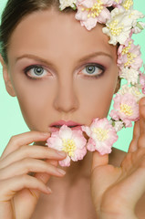 Young beautiful women with flowers