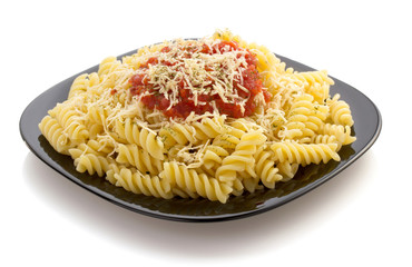 pasta fusilli in plate on white