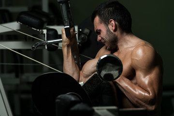 Young Man Working Out Biceps