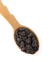 raisins fruit in spoon on white