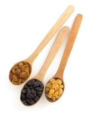 raisins fruit in spoon on white