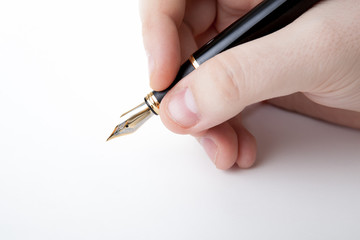 pen in the man's hand to signature