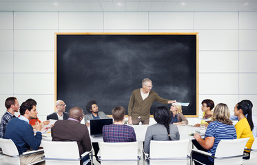 Group of Business People Listening to the Leader
