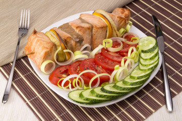 Salmon with vegetables and cutlery