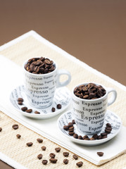 coffee cups full of coffee beans