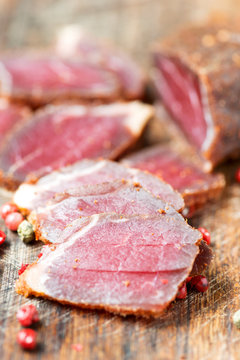 Slices of cured meet and pepper close up