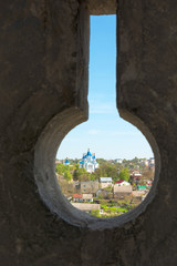 Fototapeta premium The view from the loopholes of the Old Castle at the town