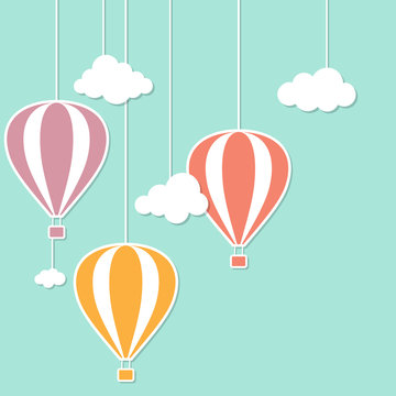 Hot air baloons and clouds in paper cutout style