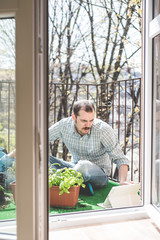 handsome stylish man gardening