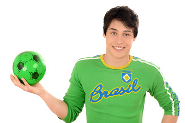 Brazilian man holding a ball in the hands. Happy football fan.