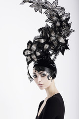 Stylish Eccentric Woman with Fanciful Make-up and Outlandish Hat