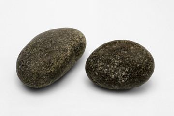 Fototapeta na wymiar Two grey pebbles isolated on white
