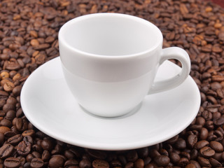 A white cup on beans background