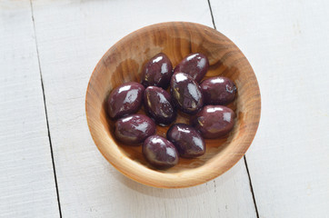 Olives on white table