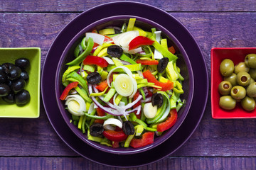 Fresh colorful vegetable salad platter wooden table