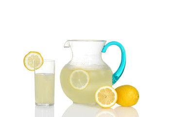 glass of lemonade with pitcher