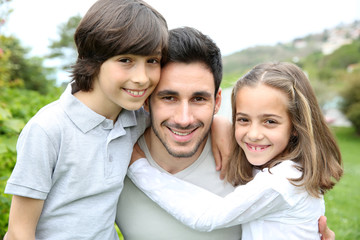 Portrait of young man with 2 kids