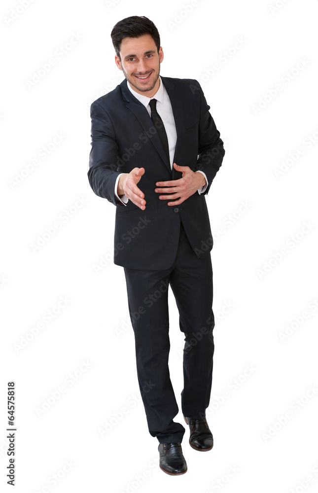 Wall mural Young businessman giving handshake, isolated