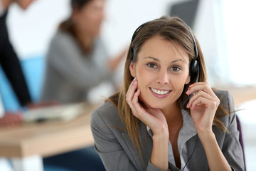 Smiling customer service representative at work