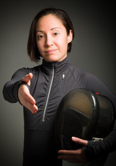 Female fencer offering hand for handshake