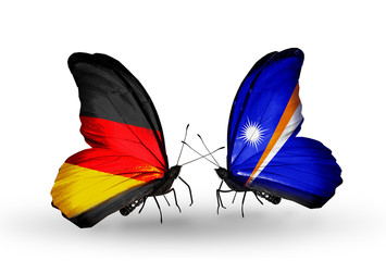Two butterflies with flags Germany and Marshall islands