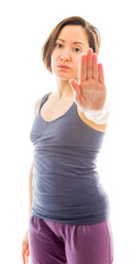 Young woman making stop gesture sign