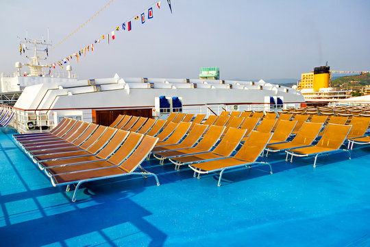 Rows of deck chairs on cruise ship