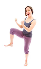 Young woman punching the air and laughing