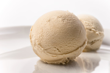 Fototapeta na wymiar Creme brulee coffee ice cream scoop on plate white background