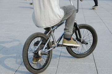Naklejka premium guy with sports clothing sit on sports BMX bicycle