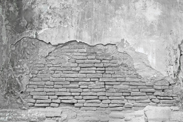 Old White brick wall with cracked concrete