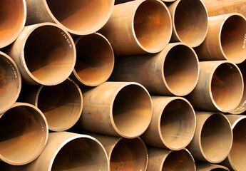 Iron pipes stacked in construction site