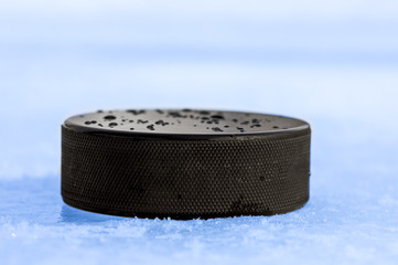 puck on blue ice