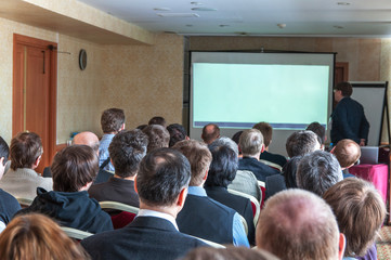 Fototapeta premium people sitting rear at the business conference