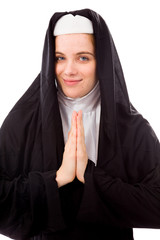 Young nun welcoming with hands clasped