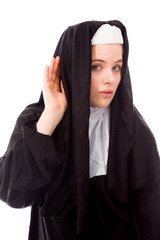 Young nun trying to listen